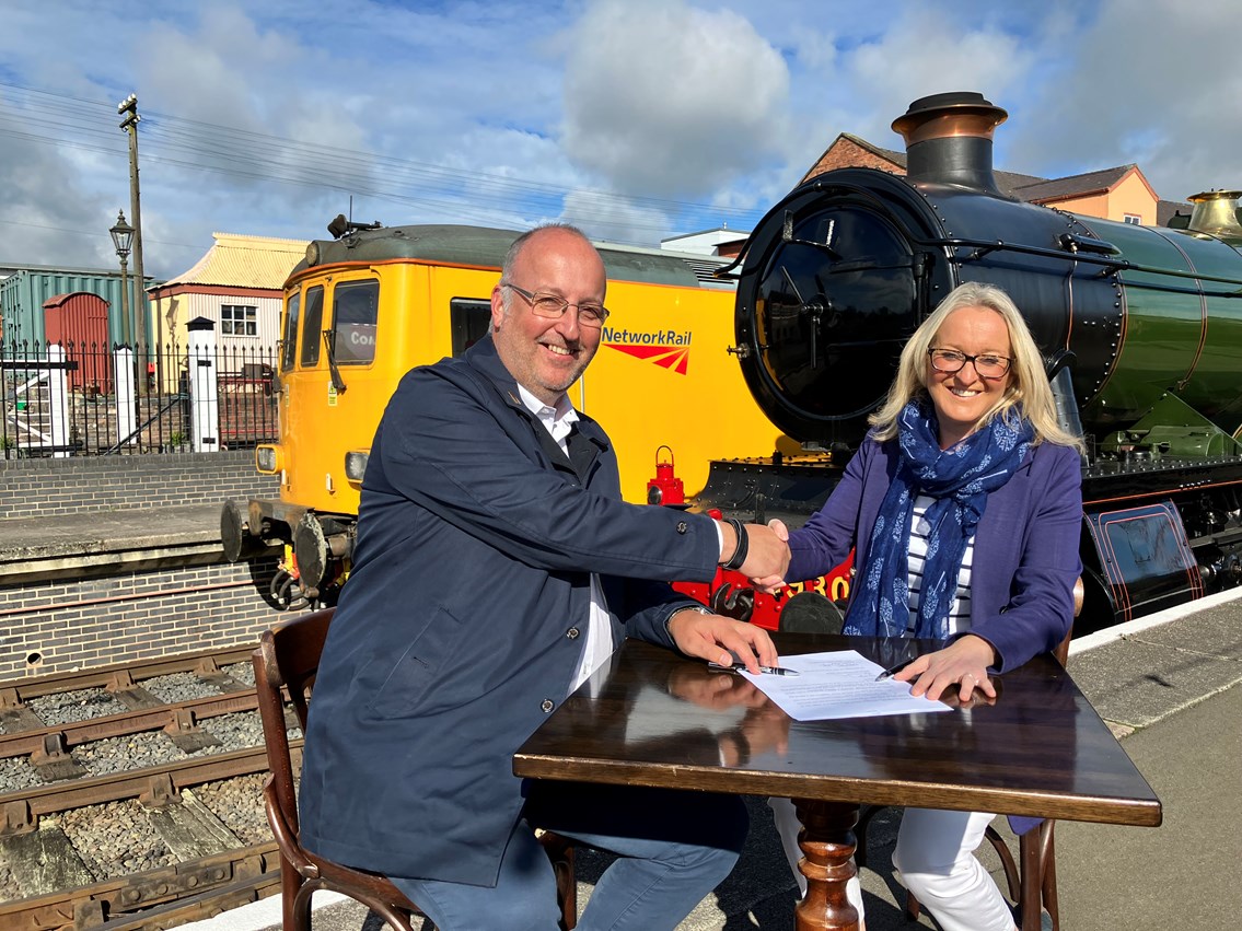 Gus Dunster, Severn Valley Railway's managing director, and Denise Wetton, Network Rail's Central route director, sign the partnership between the two railways