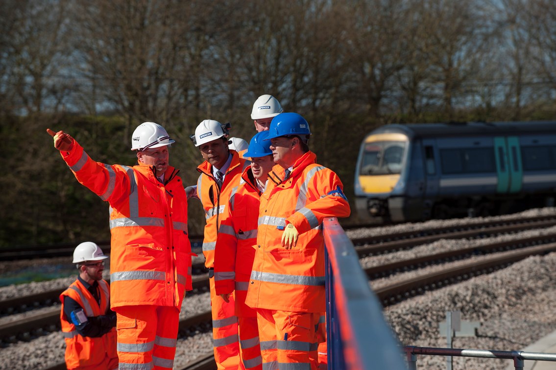 Rail minister visits new £59m Ipswich rail link: Transport minister Stephen Hammond was in Ipswich on Friday 21 March to see the newly completed 1.2km stretch of railway built by Network Rail to increase capacity for freight trains and ease a major bottleneck affecting passenger services on the Great Eastern Main Line.
Photo - tour party on bridge