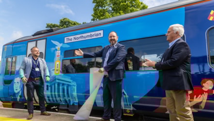 Alex Hornby, commercial and customer director, unveils train artwork celebrating the reopening of the Northumberland Line