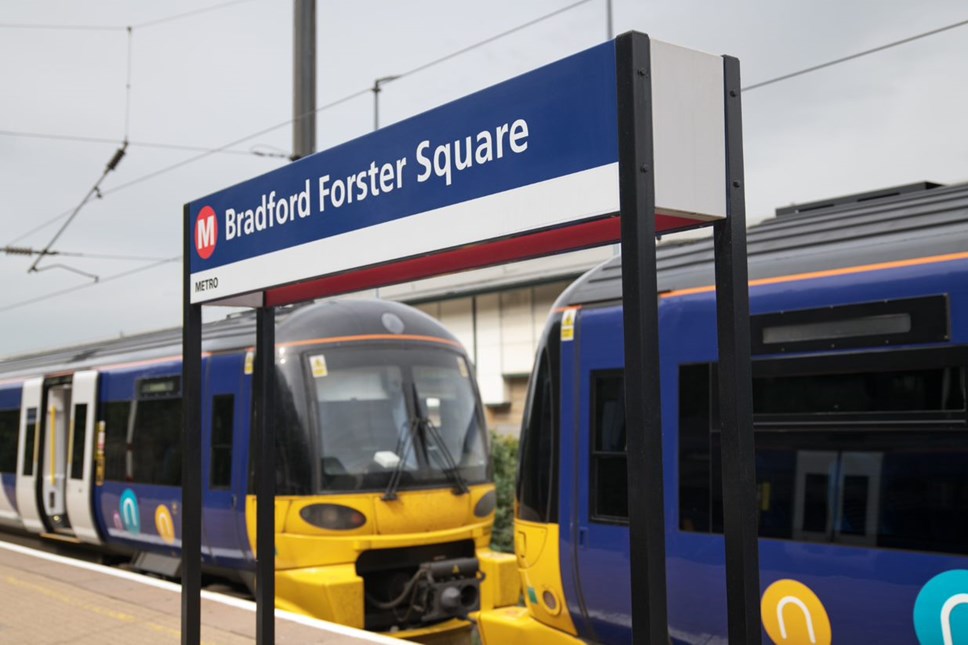 This image shows a Northern train waiting at Bradford Forster Square