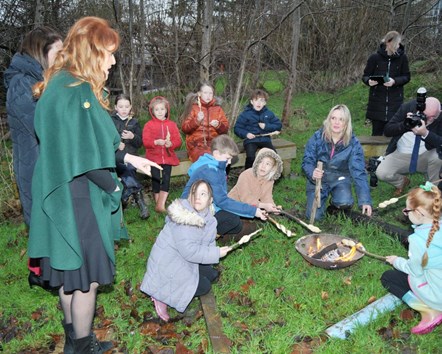 The Duchess of York with youngsters and staff at the campfire at the Forest School at Padiham Green CofE Primary School