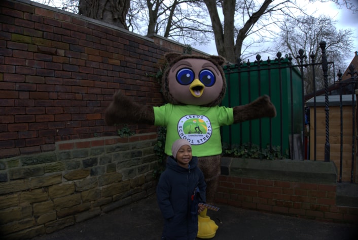 Arlo, the council's safe and sustainable travel mascot, with a pupil from Chapel Allerton Primary School: Arlo, the council's safe and sustainable travel mascot, with a pupil from Chapel Allerton Primary School