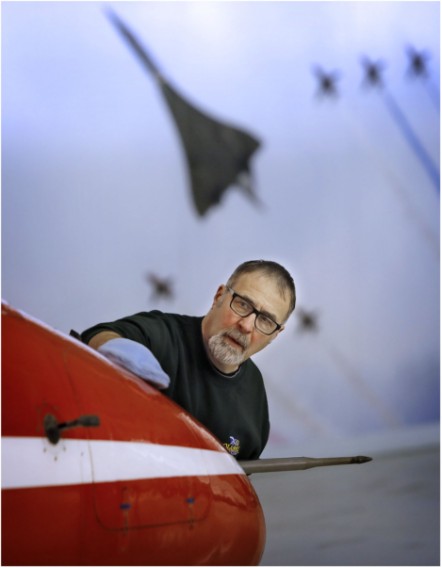 Principal Conservator, Stuart McDonald cleans a Red Arrows Hawk at the National Museum of Flight. Image (c) Paul Dodd (1)