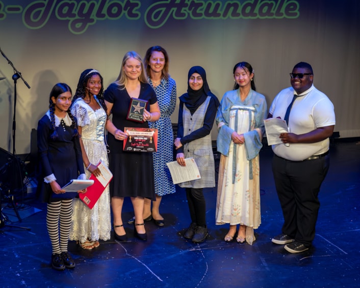 Child Friendly Leeds Awards 2024 - Leigh-Taylor Arundale: Leigh-Taylor Arundale, 14, pictured third from left, picks up the 'Child/young person of the year' award. Credit: Robling Photography