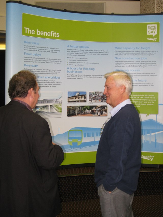 Member of the public exchanges views with Network Rail manager