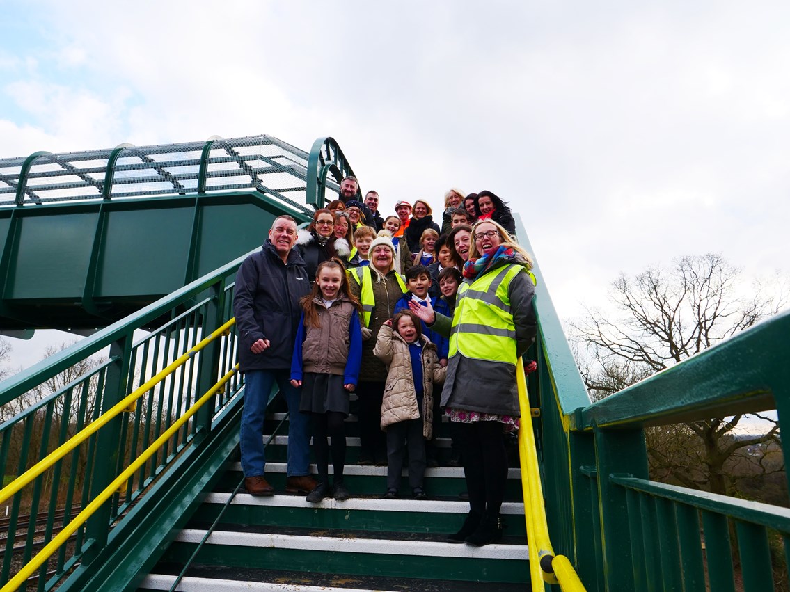 Dean Farm School: Children, parents and staff from Salfords School celebrate the opening of the new bridge at Dean Farm Crossing, Salfords, Surrey
