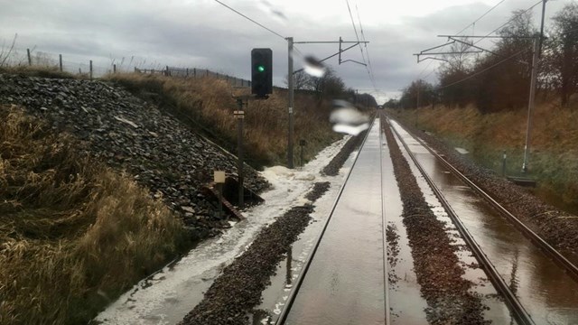 Passengers warned further wet weather could cause rail disruption: Stock images of previous flooding from Storm Ciara February 2020