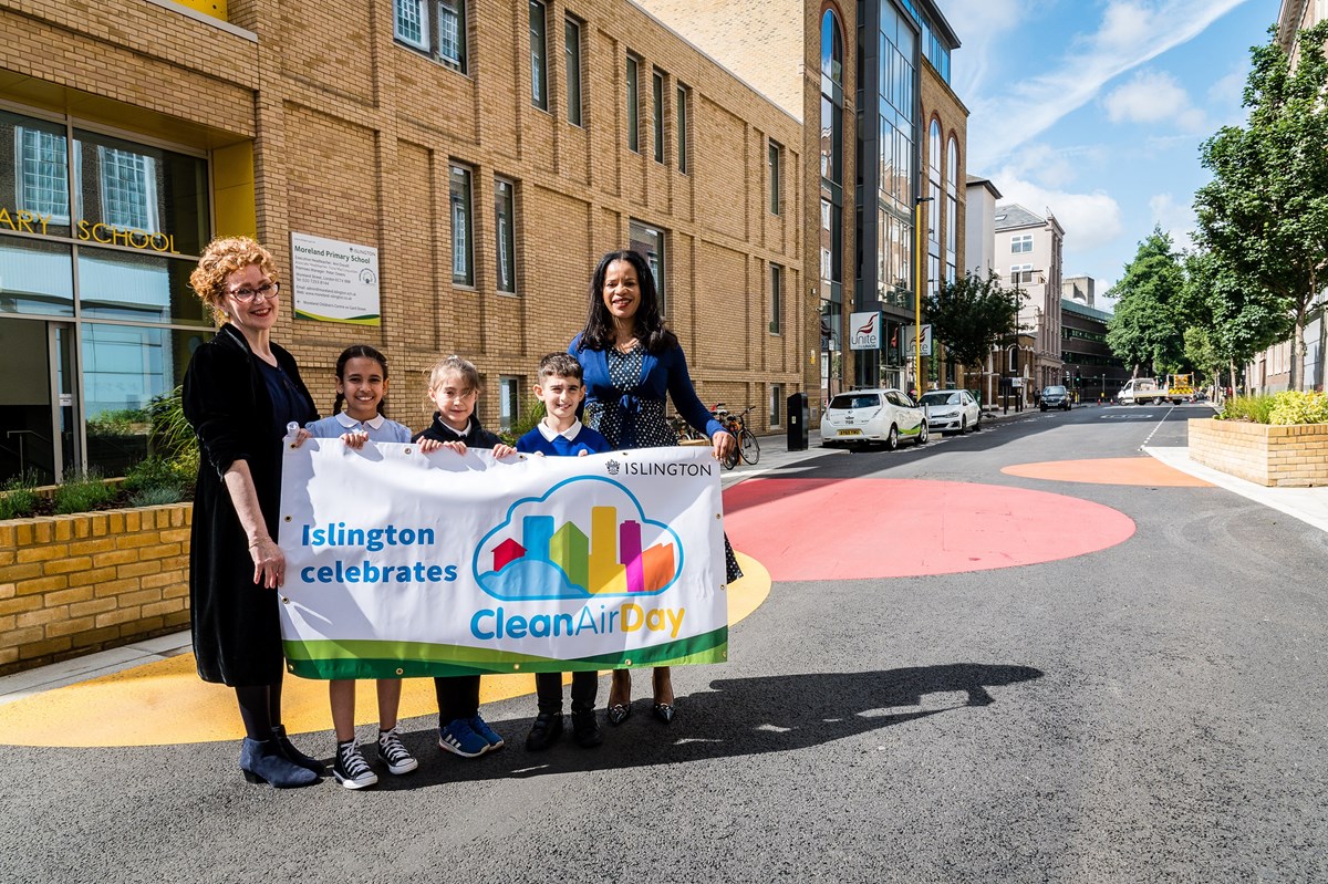 Children join Ann Dwulit, executive headteacher of Moreland Primary School (L) and Cllr Claudia Webbe (R) for the launch of Moreland Street on Clean Air Day 2019