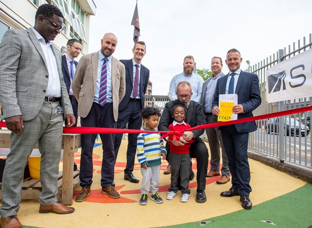Deptford ribbon cutting: Cutting the ribbon to open the new playground at Grinling Gibbons school, Deptford