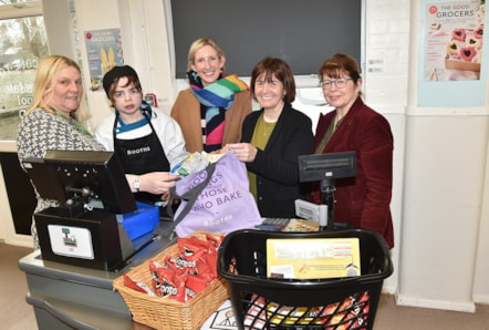 County Councillors Jayne Rear (right) and Phillippa Williamson (second from right), pictured with Sebastian, a pupil at Bleasdale School, along with staff from Booths supermarket.