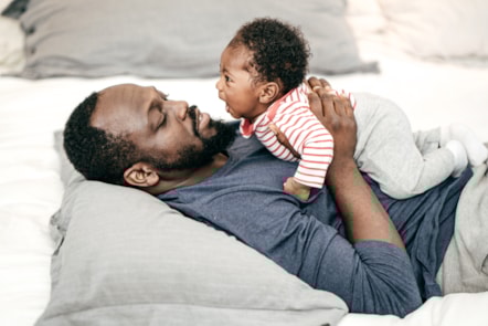 father and child on sofa