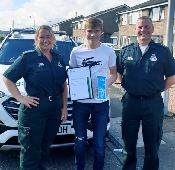 Fifteen-year-old local hero presented with SAS certificate: Alfie with Valerie and Keith Jensen
