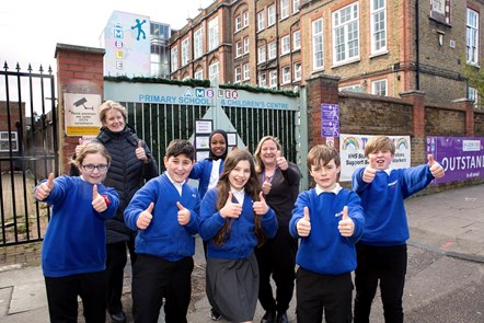 Children at Ambler Primary School celebrate the upcoming arrival of measures to make the school gate cleaner, greener and healthier: Photographed are Cllr Rowena Champion (back row; far left) and Juliet Benis, headteacher at Ambler Primary School (back row; far right)