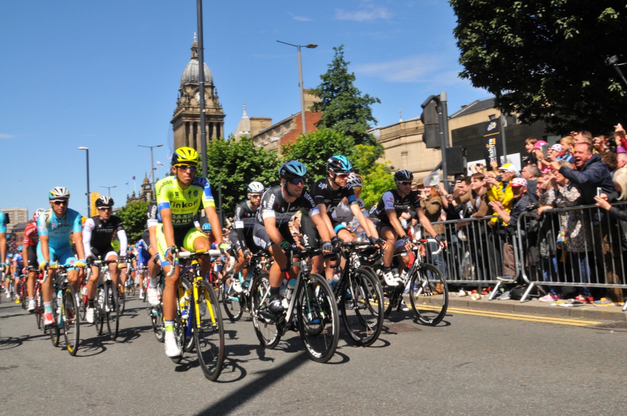 Leodis TdF gallery: Riders prepare for the start of the 2014 Tour de France Grand Depart on The Headrow in Leeds on July 5, 2014. The tour then headed eastwards through the city centre towards Quarry Hill, navigating the Sheepscar Interchange onto the A61 and heading northwards through Scott Hall, Moortown and Alwoodley towards Harewood House. Credit Leeds City Council.