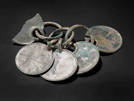 Bronze rattle pendant from the Peebles Hoard. Image © National Museums Scotland