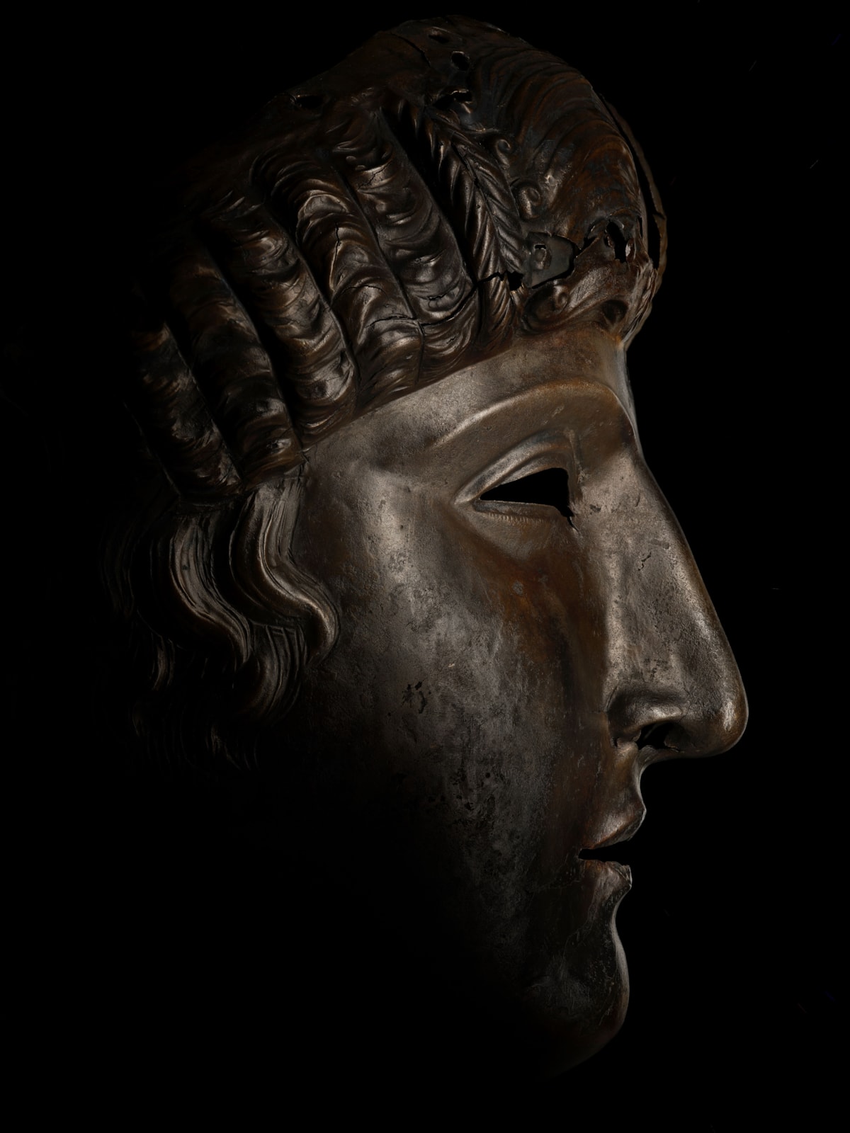 Bronze facemask, Newstead, late 1st Century AD. Image © National Museums Scotland 3