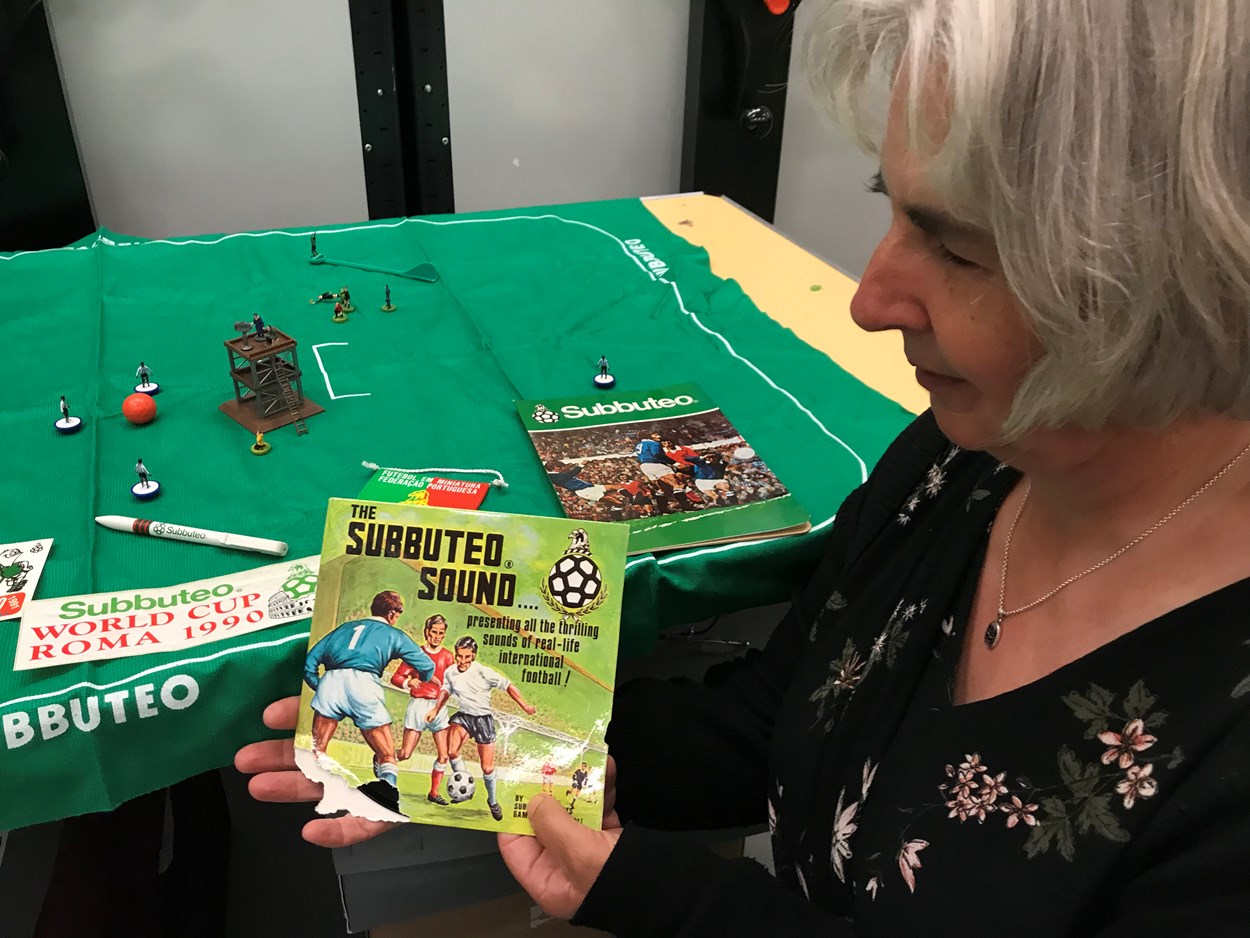 Subbuteo collection: Kitty Ross, curator of social history, with accessories from the newly-acquired Subbuteo sets which have become part of the Leeds Museums and Galleries collection. These include a vinyl record of The Subbuteo Sound designed to be played during games.