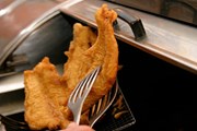 Fish coming out of the fryer