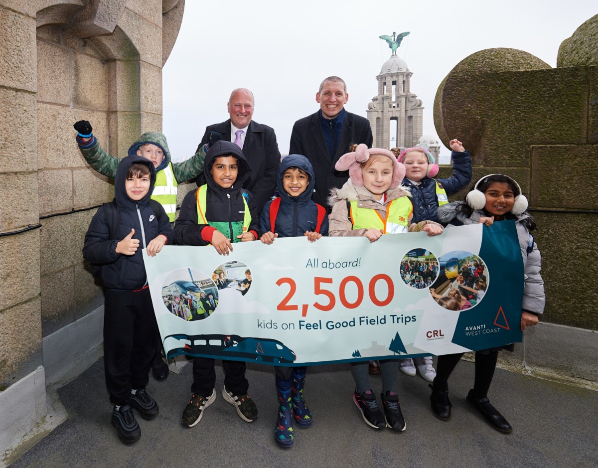 Beechwood Primary School pupils celebrate 2,500 children to enjoy Feel Good Field Trips with Andy Mellors (Avanti West Coast Managing Director) and David Savage (Community Rail Officer at Community Rail Lancashire) at Royal Liver Building in Liverpool