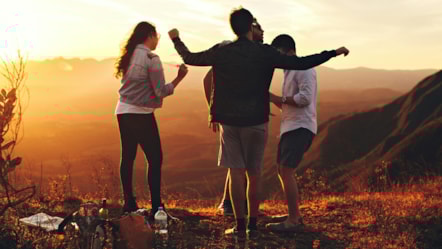 People outside at sunset
