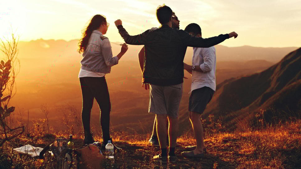 People outside at sunset