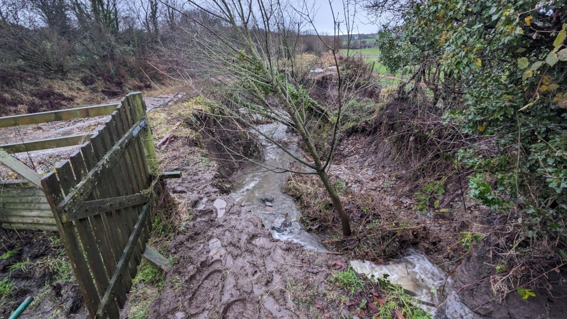 The nearby watercourse which was flooded with melted snow