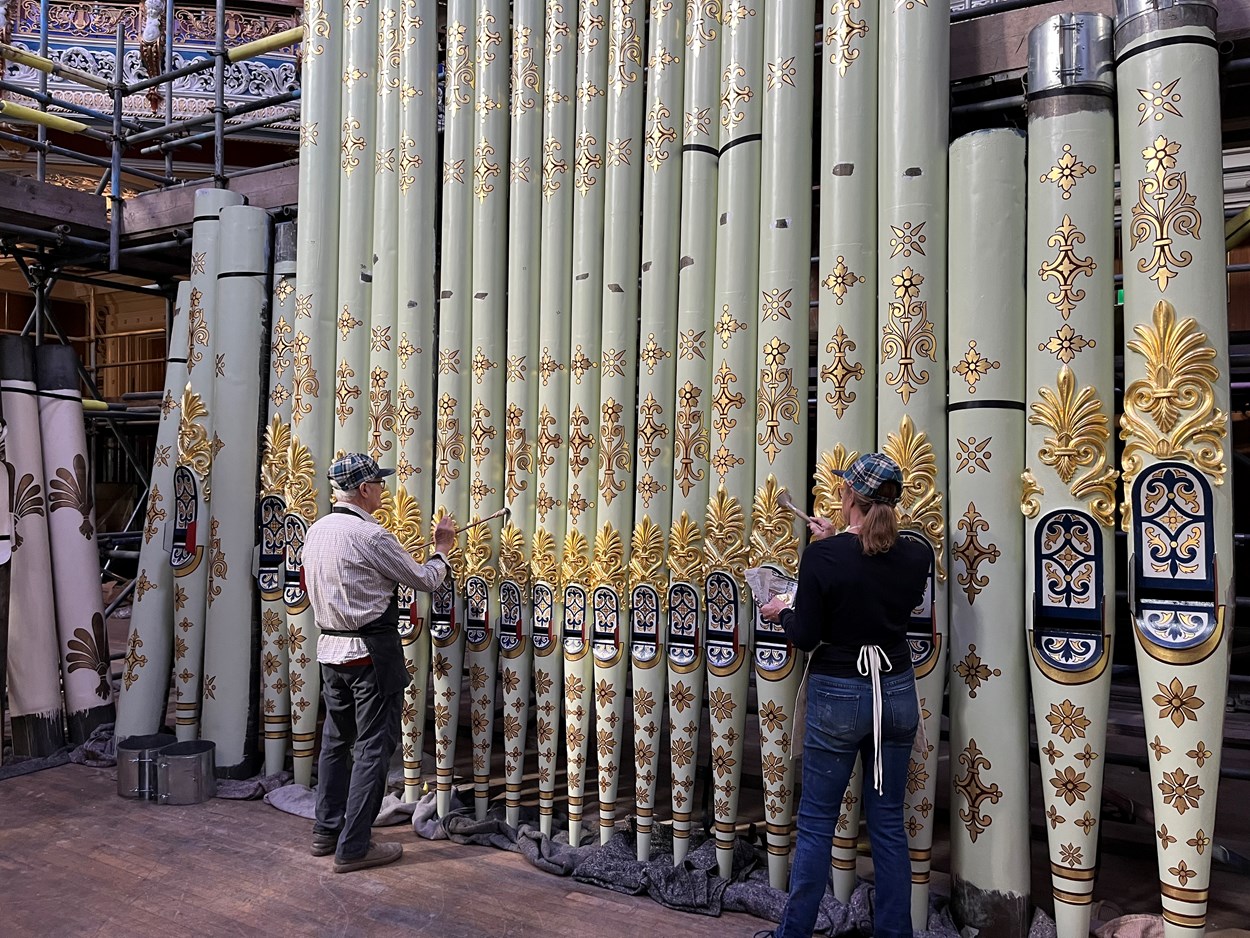 Leeds Town Hall organ pipes renewal: Specialist artists, Robert Woodland MBE and Debra Miller of The Upright Gilders, have taken on the painstaking task of recreating the spectacular appearance the organ pipes had when the iconic building’s Victoria Hall hosted the queen and other dignitaries for its opening night in 1858.