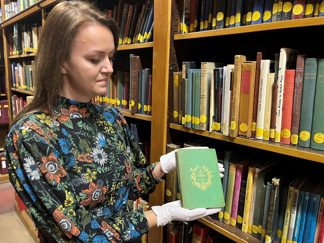 Leeds Central Library's poisonous book: Rhian Isaac, Leeds Central Library's senior librarian with the library's copy of My Own Garden: The Young Gardener’s Yearbook. Published back in 1855, it has been safely tucked away behind the scenes at Leeds Central Library, well away from visitors.
Recent research carried out by experts at the library revealed that the seemingly unassuming book most likely owes its vivid, emerald, green colour to a dye containing quantities of arsenic, which can be lethal when ingested.