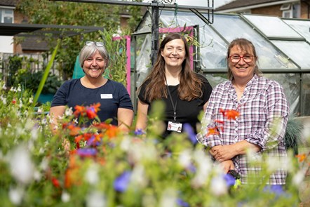 (L - R): Jo Buckley (Community Manager at Avanti West Coast); Emma McIntosh (Community Rail Partnership Officer at North Staffordshire Community Rail Partnership); Debbie Shering (Volunteer at Sherborne Community Hub) in the garden at Sherborne Community Hub in Crewe