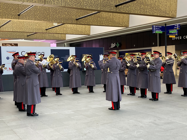 Live band in full swing at Leeds station on Poppy Day: British Army Band Catterick