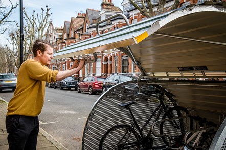 Bart Smith, Islington Council's Active Travel Officer, uses one of the borough's bike hangars