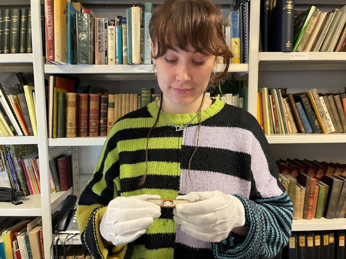 Microscope slides: Lizzie Gothorp, Leeds Museums and Galleries’ project placement with the microscope slide containing a microscopic sea creature found during one of history’s most renowned and influential scientific voyages are also among the amazing array of slides.
The HMS Challenger left Sheerness on the north Kent coast in 1872, embarking on an unprecedented mission to circumnavigate the globe and comprehensively explore the deep seas for the first time.
Examples found in the Leeds collection today include small disc-like fossils called orbitolites which were gathered 18 fathoms down off the coast of Fiji.