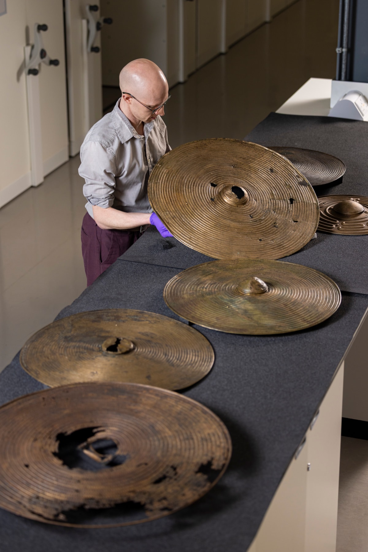 National Museums Scotland curator Dr Matthew Knight with the Bronze Age shields. Photo © Duncan McGlynn (6)