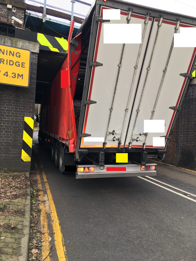 Lorry stuck under Grantham railway bridge