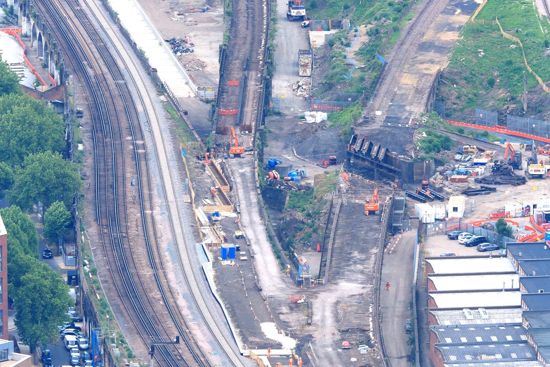 Bermondsey aerial: Demolition begins at Bermondsey. When complete, Charing Cross trains will arrive at top left, dive down, and run on a new railway diagonally top left to bottom right of the picture. Thameslink trains will arrive at top right, and pass over the Charing Cross lines as they head towards the centre- bottom of the picture. Both existing (and now disused) viaducts,  middle and right, will be partly demolished.