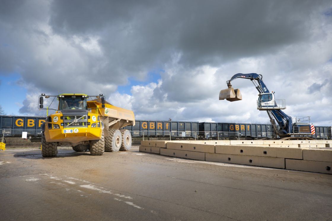 Material delivered by rail to Quainton railhead is taken away on an articulated dumper truck Feb 2024