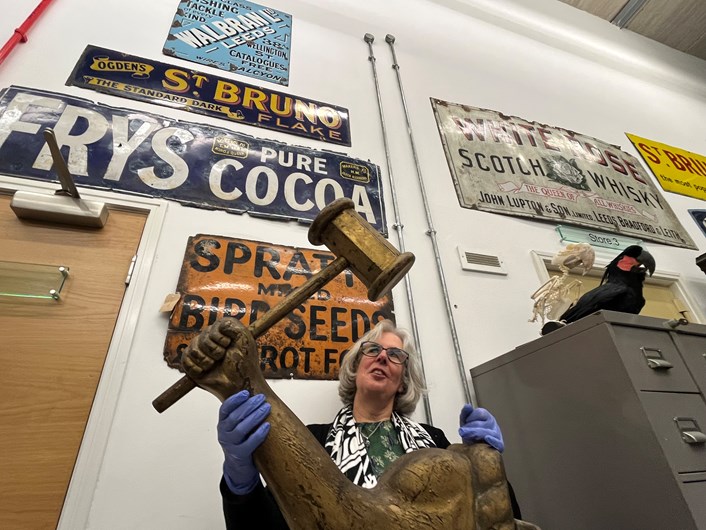 Power of Persuasion: Part of the exhibition will be a selection of vintage signs which once adorned the streets of Leeds. These include a huge wooden arm and hammer which once advertised a Victorian gold beater’s shop, held here by KItty Ross, curator of social history with Leeds Museums and Galleries.