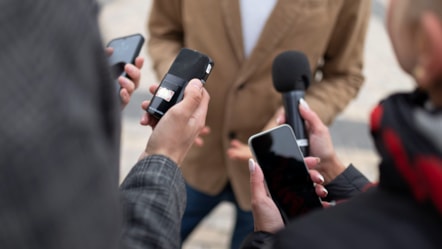 close-up-reporter-taking-interview