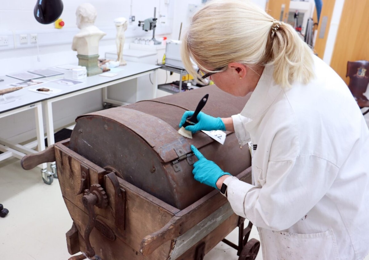 Curator Jenny Truran cleans cheesemaker-2