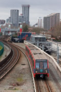 TfL Image - DLR trains passing through the Royal Docks: TfL Image - DLR trains passing through the Royal Docks