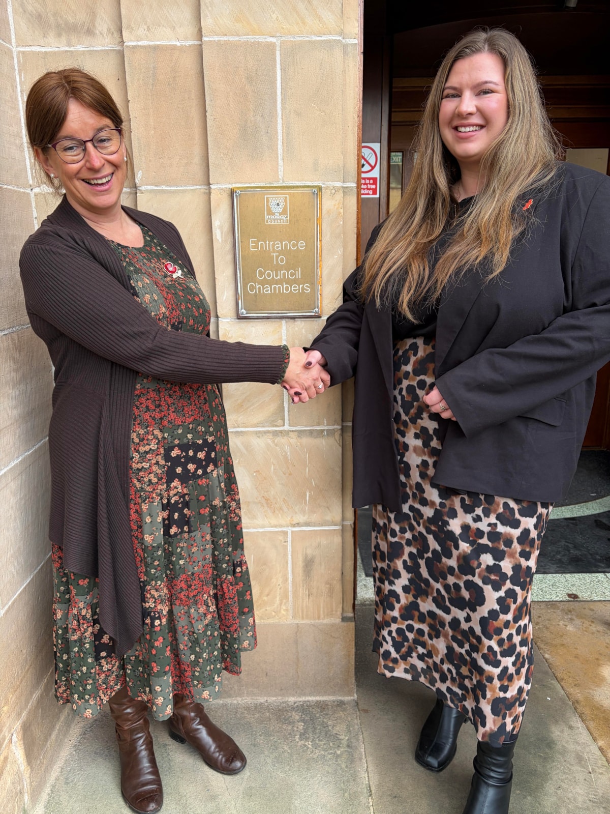 Moray Council Leader Cllr Robertson congratulating Cllr Dunbar