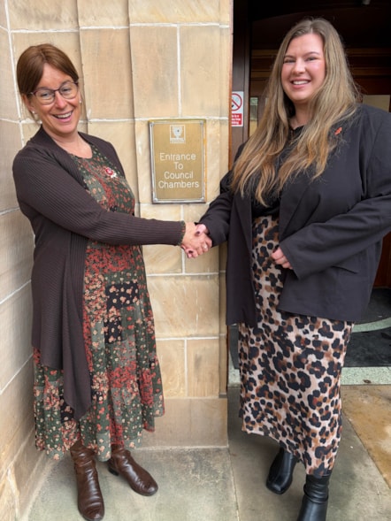 Moray Council Leader Cllr Robertson congratulating Cllr Dunbar