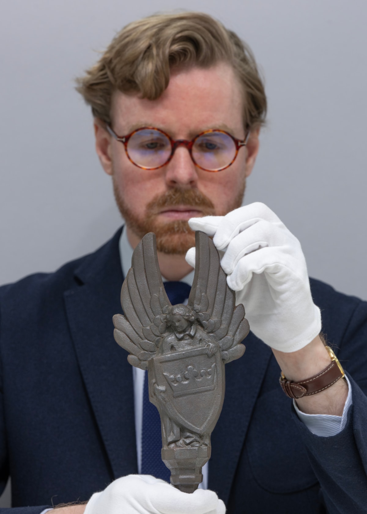 National Museums Scotland Curator Dr Calum Robertson with the cast iron angels. Image (c) Neil Hanna (1)
