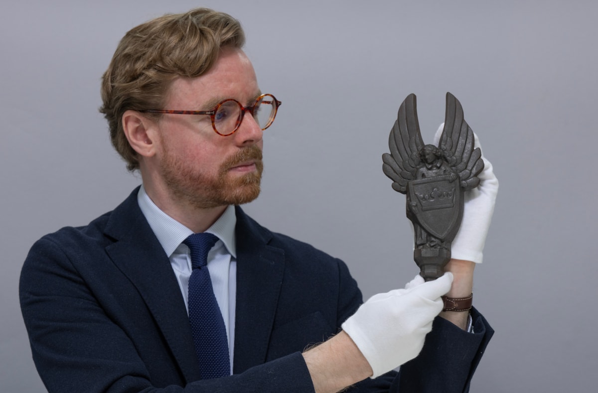 National Museums Scotland Curator Dr Calum Robertson with the cast iron angels. Image (c) Neil Hanna (3)