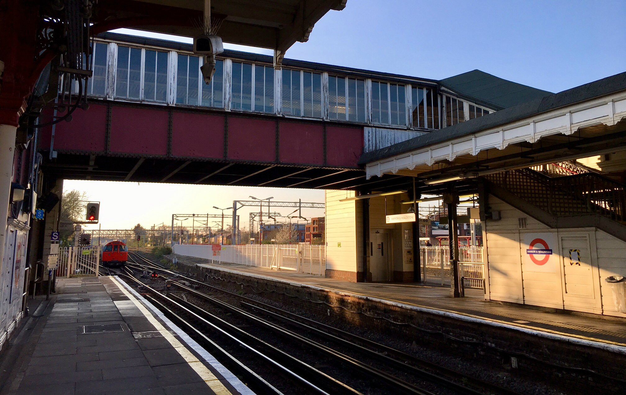 Harrow and Wealdstone station footbridge at dusk May 2019