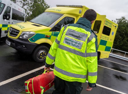 Paramedic walking to ambulance