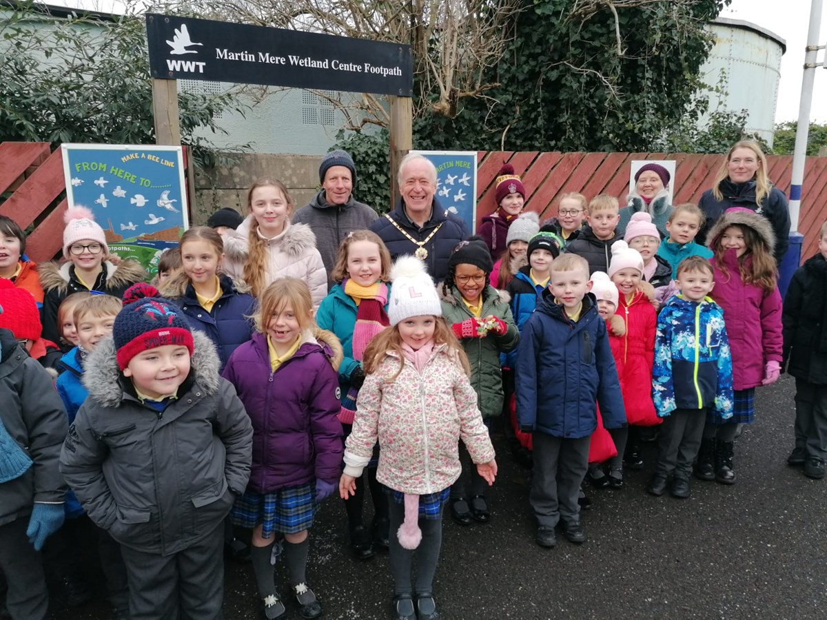 Image shows  Burscough Bridge Methodist Primary school pupils with the artwork they created with artist Angie Thompson