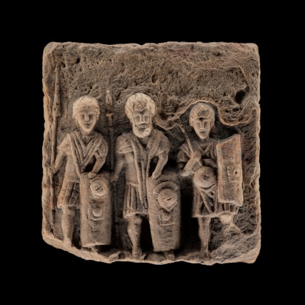 Sandstone sculpture of three legionaries, Croy Hill, 200 - 300 AD. Image © National Museums Scotland