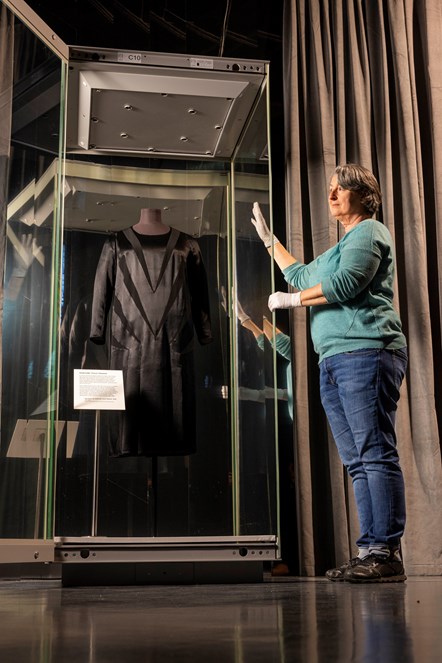 Heidi Blöcher, Textile Conservator, Staatliche Museen zu Berlin, Kunstgewerbemuseum, installs a rare 1926 Chanel dress at the National Museum of Scotland ahead of the opening of Beyond the Little Black Dress on 1 July. The new style, hailed by US Vogue at the time as “the frock that all the world will wear”, combined couture details with modest origins and secured Chanel’s reputation as the inventor of the fashionable ‘LBD’. On loan from Staatliche Museen zu Berlin, Kunstgewerbemuseum. © Chanel. Image credit Duncan McGlynn