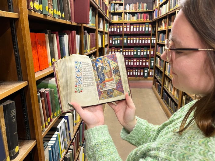 The Book of Hours: Library and digital assistant Alex Brummitt with The Book of Hours at Leeds Central Library.
Penned in around 1480 and inscribed on delicate vellum, the Horae beatae Mariae Virginis, or Book of Hours, contains forty-six vividly illuminated images depicting various duties to be carried out each month along with the signs of the zodiac.